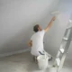expert painter preparing walls 80x80