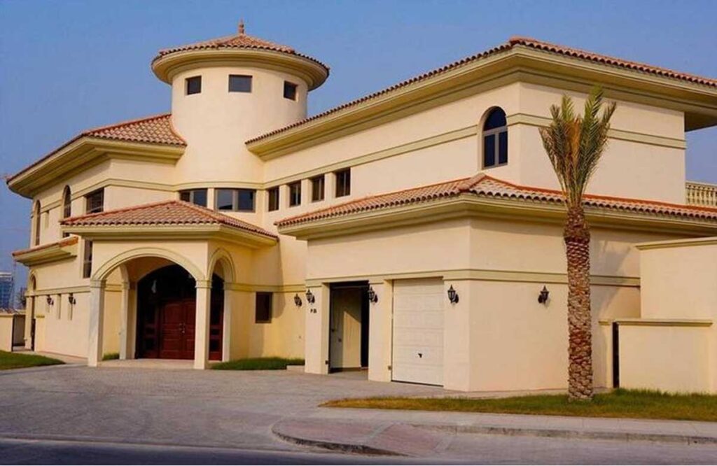 Elegant beige villa with Mediterranean-style architecture and fresh exterior wall finish — exterior painting services Dubai.