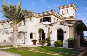 Modern villa exterior with elegant finish and well-maintained garden, reflecting the Cost to Hire a Painter in Dubai for high-quality residential painting.