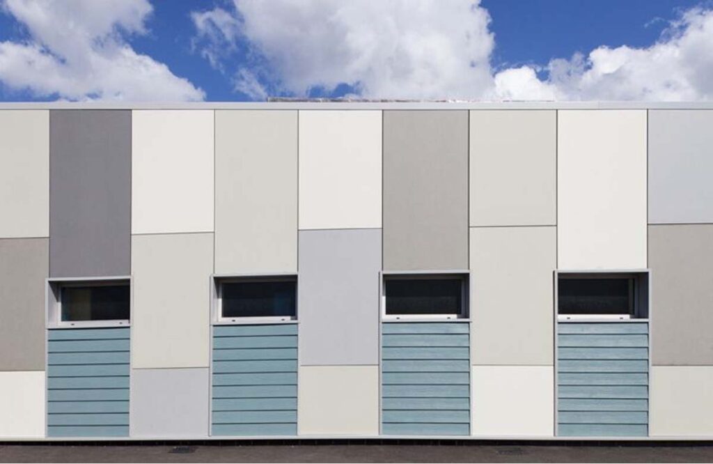 Modern factory wall after professional coating, showcasing clean and durable finish by industrial painting services in Dubai.