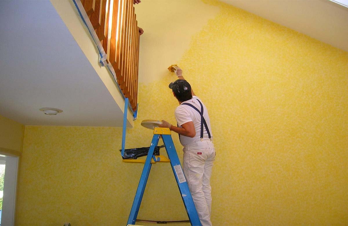Service Hub painter applying a fresh wall coating in a Dubai home