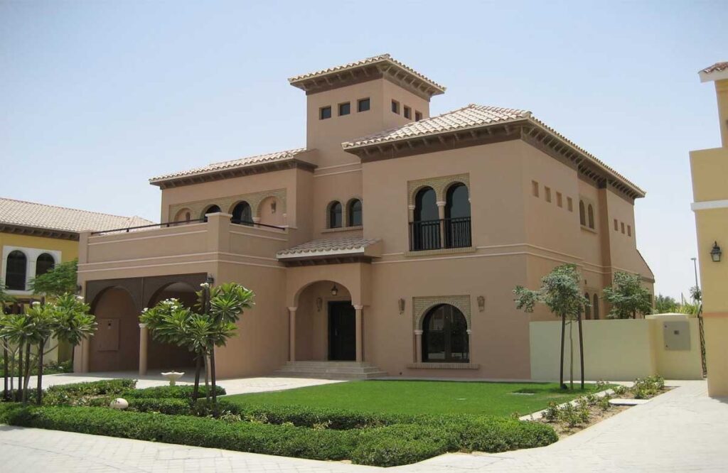 Why Do Dubai Villa Exteriors Need Repainting Every 2 Years ? | Elegant villa in Dubai with smooth beige wall paint, showcasing expert Wall Painting Services in Dubai