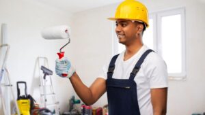 A person with roller show the paint service of home in sports city.