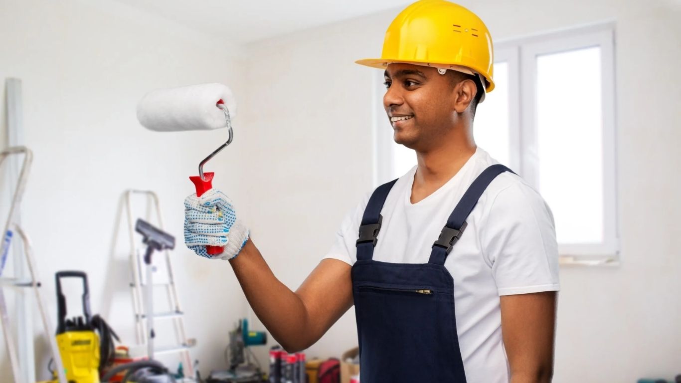 A person with roller show the paint service of home in sports city.