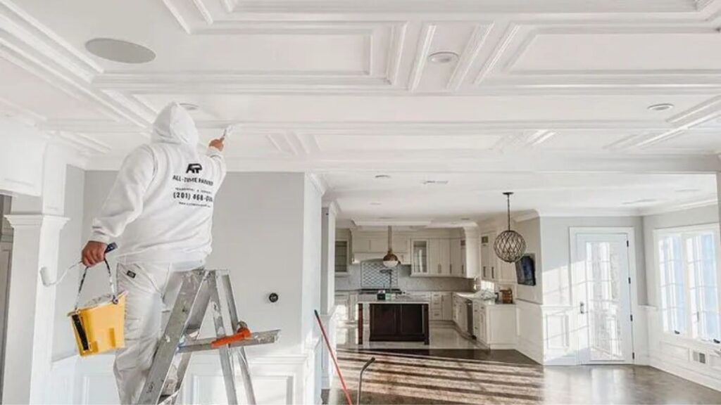 A person work on the interior roof paint in sport city of Dubai.